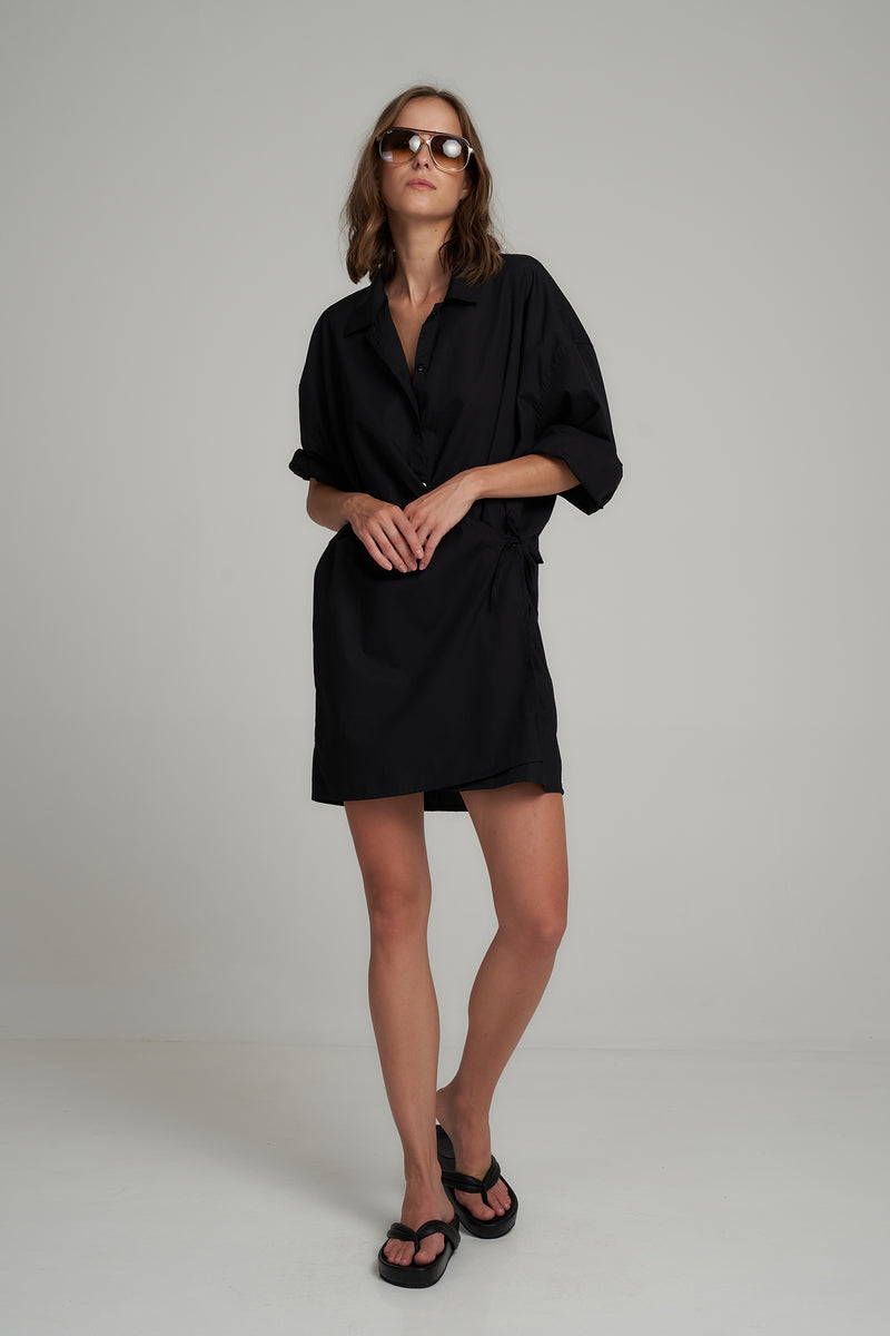 A Model Wearing a Black Cotton Mini Shirt Dress for Summer