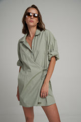 A Model Wears a Asymmetrical Green Cotton Mini Dress