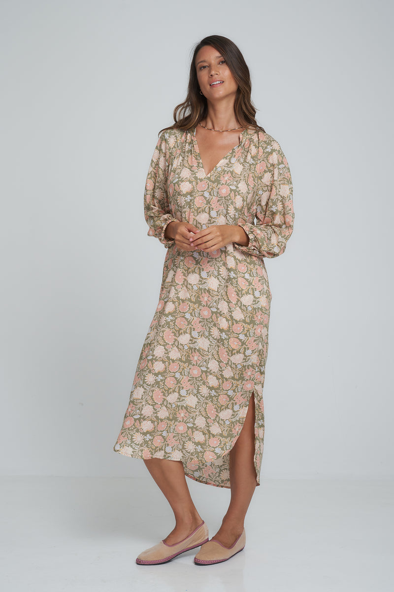 A Model Wearing a Long Sleeve Midi Floral Dress