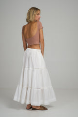 A woman wearing the Corsica Lace Skirt in Ivory by LILYA