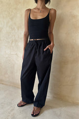 Front view of the Coconut Pants in Black featuring a comfortable drawstring waist and ankle-length fit.