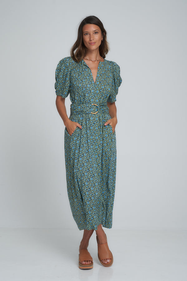 A woman in a vintage style floral maxi dress