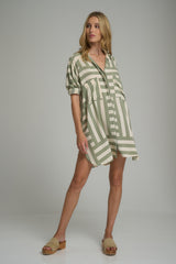 A model wearing a green casual shirt dress