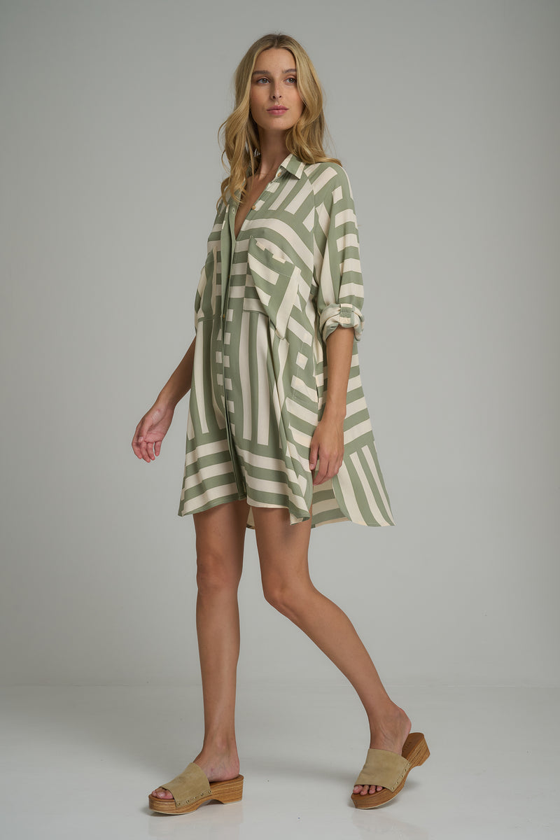 A model wearing the Dali Shirt Dress in Oxford Block Pesto/Cashmere by LILYA