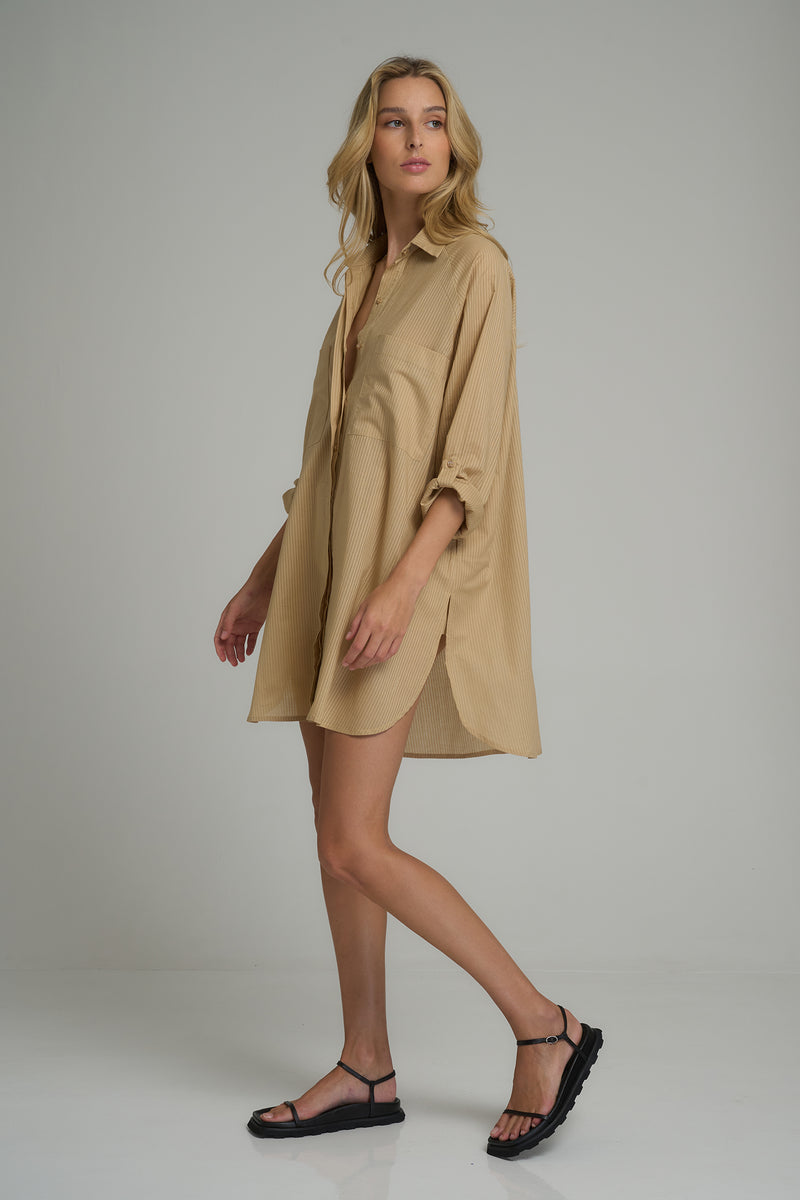 A model wearing a natural cotton shirt dress