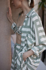 A model wearing a green shirt dress in Australia