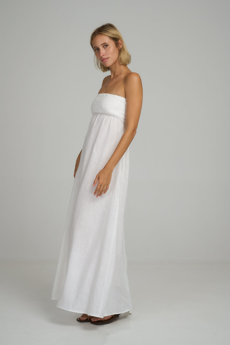 Side view of a strapless white linen summer dress