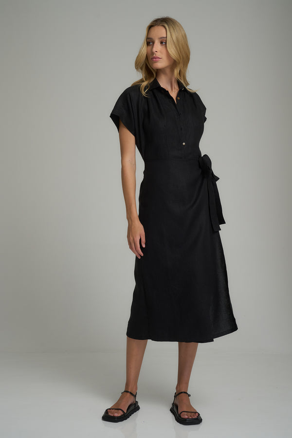 A model wearing a black linen midi dress