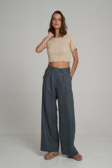 A Model Wearing a Natural High Rise Tailored Linen Pant