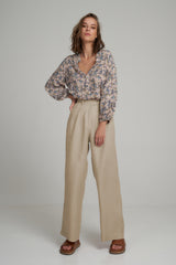A Woman Wearing High Rise Natural Linen Work Pants