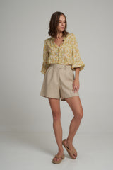 A Model Wears Natural Linen Shorts by LILYA