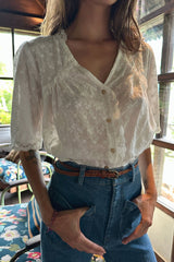 Model wear white top with embroidery and lace detail with jeans