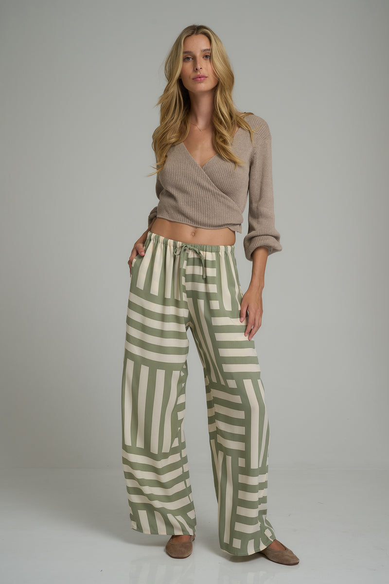 A model wearing casual green soft rayon pants