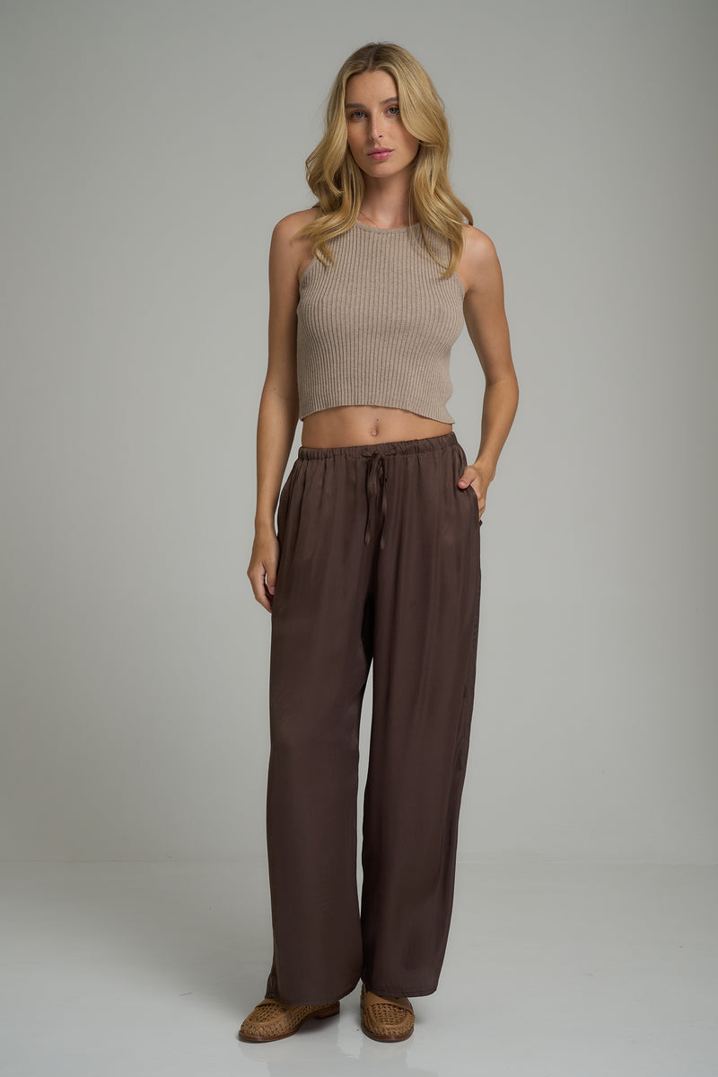 A model wearing dark brown casual pants