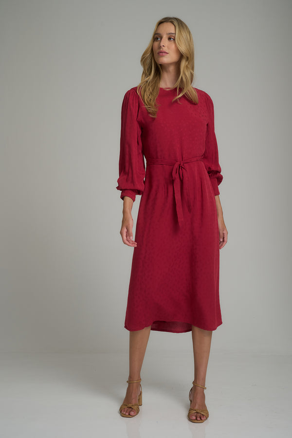 A model wearing a red wrap dress for winter