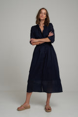 A Model Wears a Navy Cotton Midi Shirt Dress by LILYA