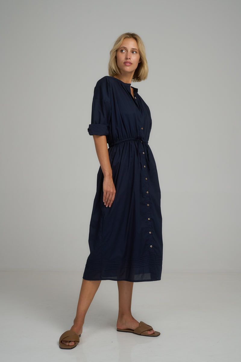 A woman wearing a navy classic cotton midi dress