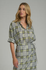 A woman wearing a casual cotton check top