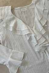 Detail photo of white blouse with flared sleeves 70s feel