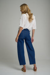 A model wearing dark blue denim jeans for women