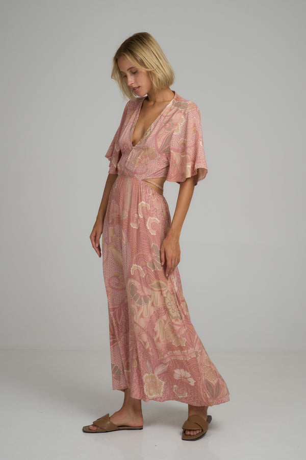 A model wearing a batik print maxi dress