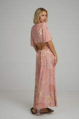 A model wearing a pink/khaki floral maxi dress in Australia