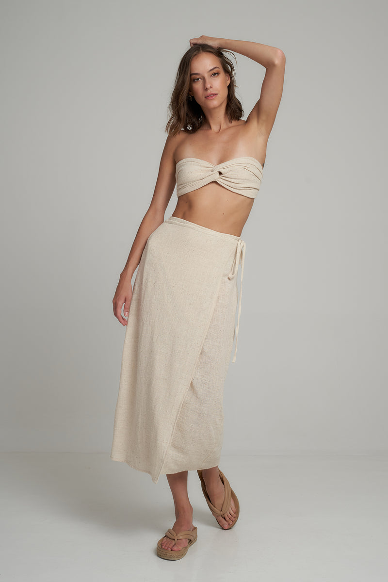 A Woman Wearing a White Cotton Midi Wrap Skirt
