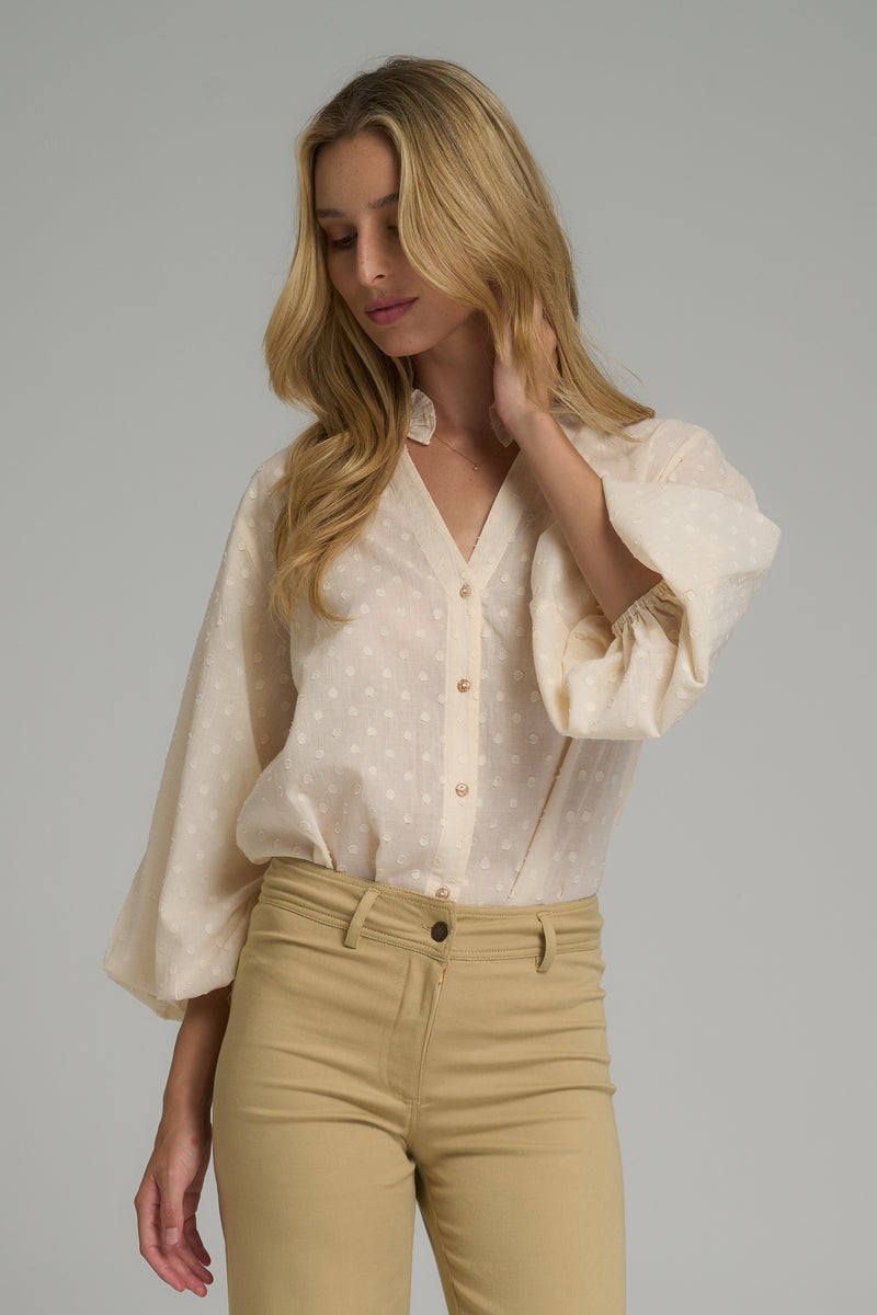 A model wearing a natural cotton casual blouse