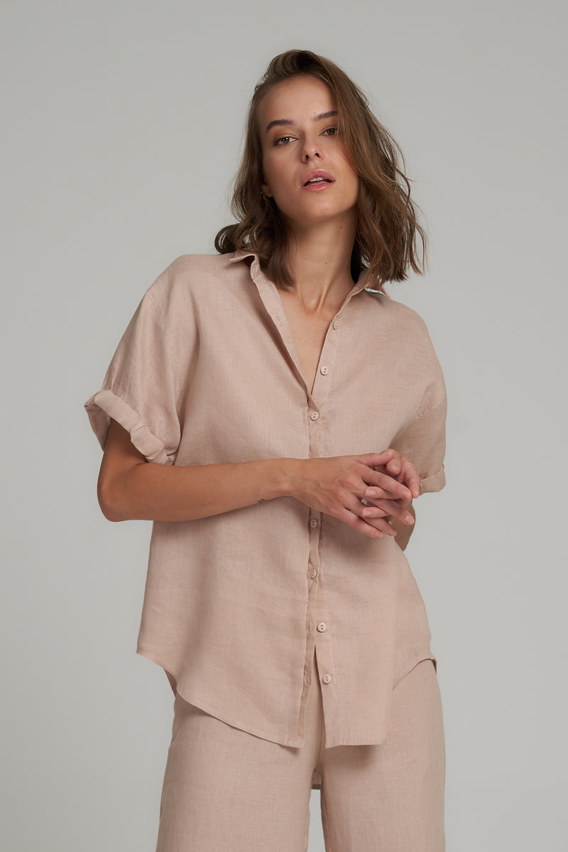 A Model Wearing a Natural Short Sleeve Linen Top in Australia