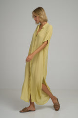 A model wearing a yellow maxi shirt dress in Australia