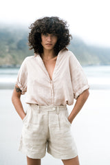A Model Wears a Natural Short Sleeve Classic Linen Blouse