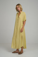 A model wearing a summer yellow cotton shirt dress