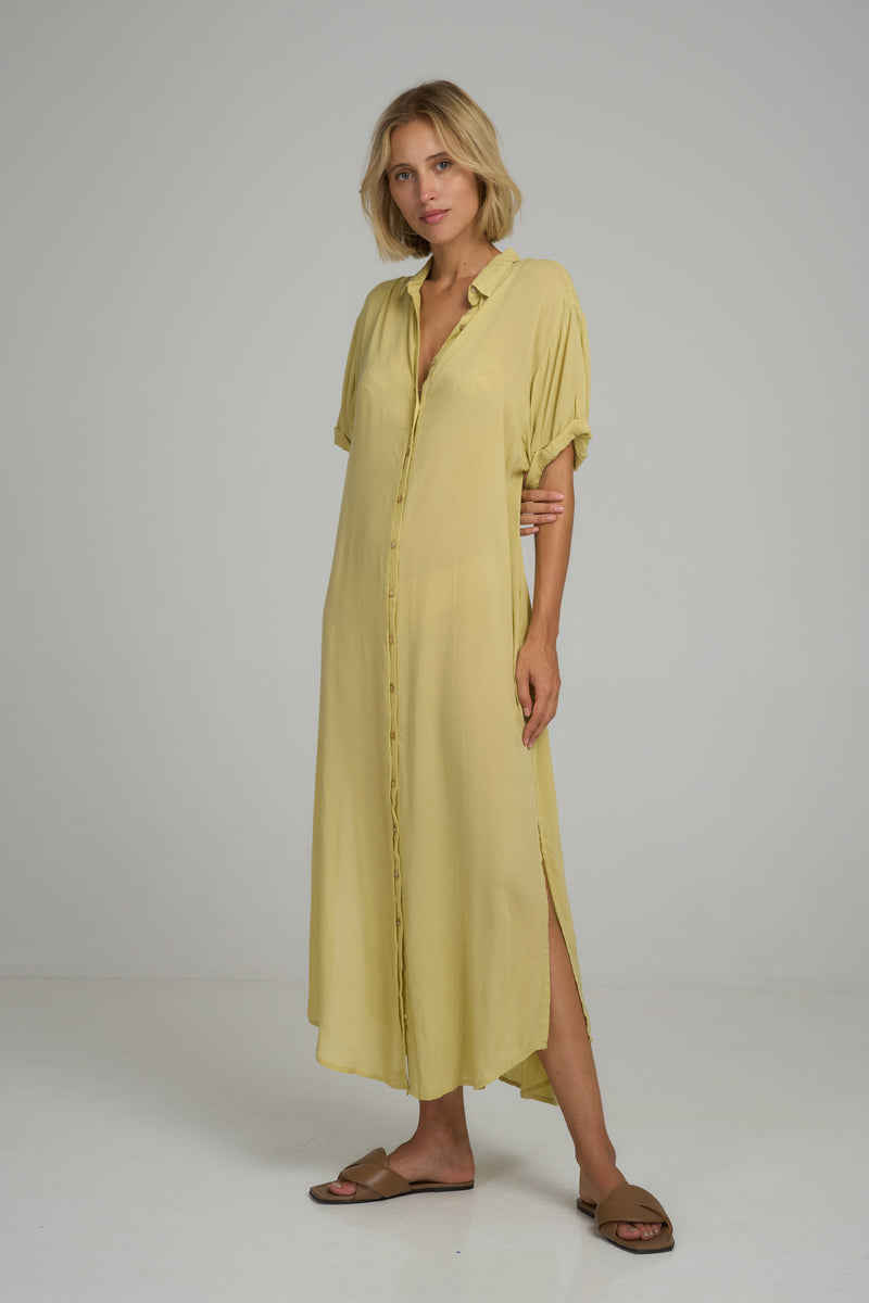 A model waring a yellow maxi summer dress