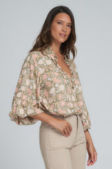 A Woman in a Floral Long Sleeve Top