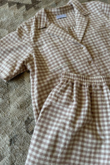 A cotton check button through top