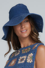 A Model Wearing a Denim Blue Wide Brim Hat
