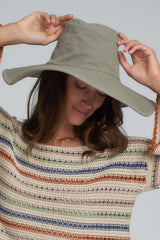 A Model Wearing the Island Moss Green Hat by LILYA