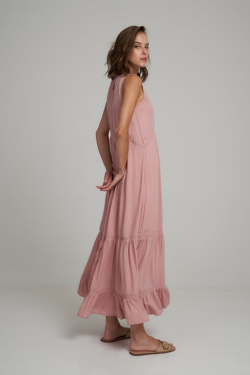 A Side View of a Pink Maxi Dress with Pintuck Details