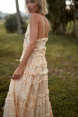 Back view of a yellow floral summer maxi dress