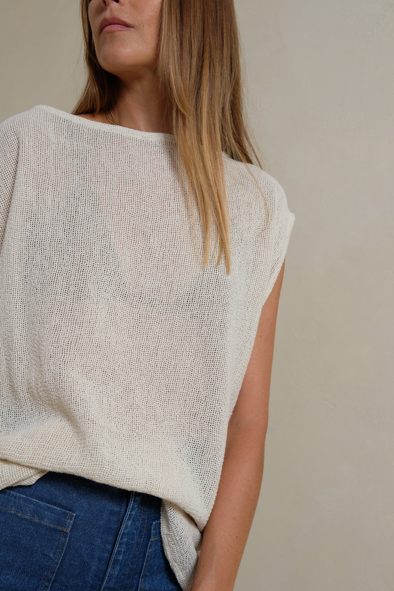 Close-up of breathable cotton mesh fabric in cream