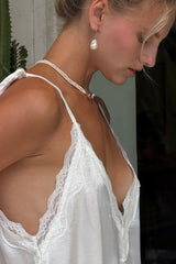 Close-up of the lace detailing on the Oriana white cami top by LILYA