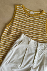 Flat lay image of knit top with ribbes binds for summer