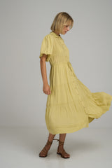 A model wearing a yellow summer midi dress in Australia