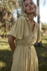 A model wearing a yellow summer casual dress