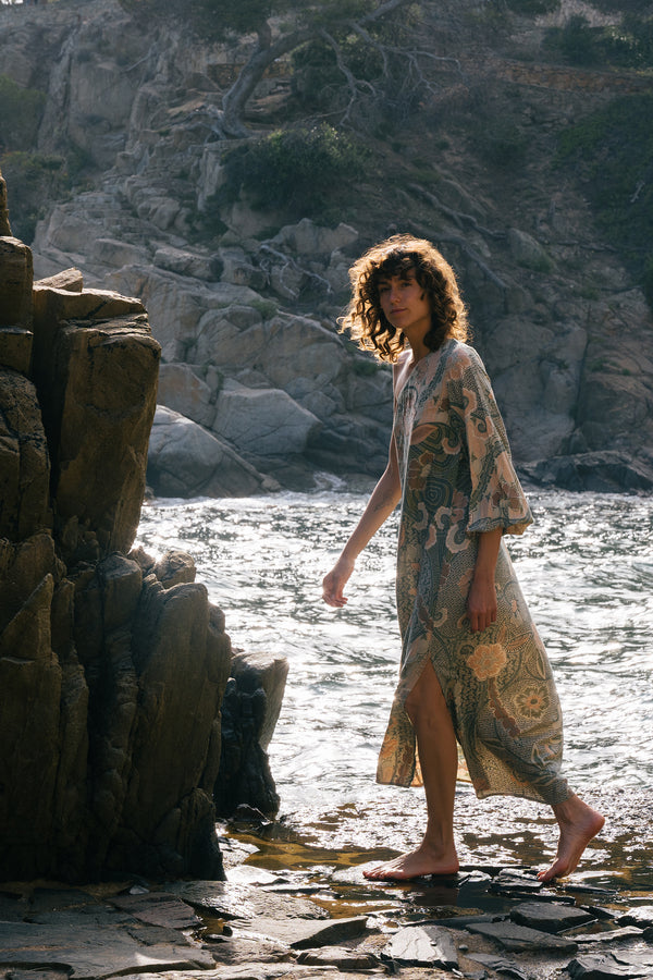 A model wearing a green batik print maxi dress in Australia