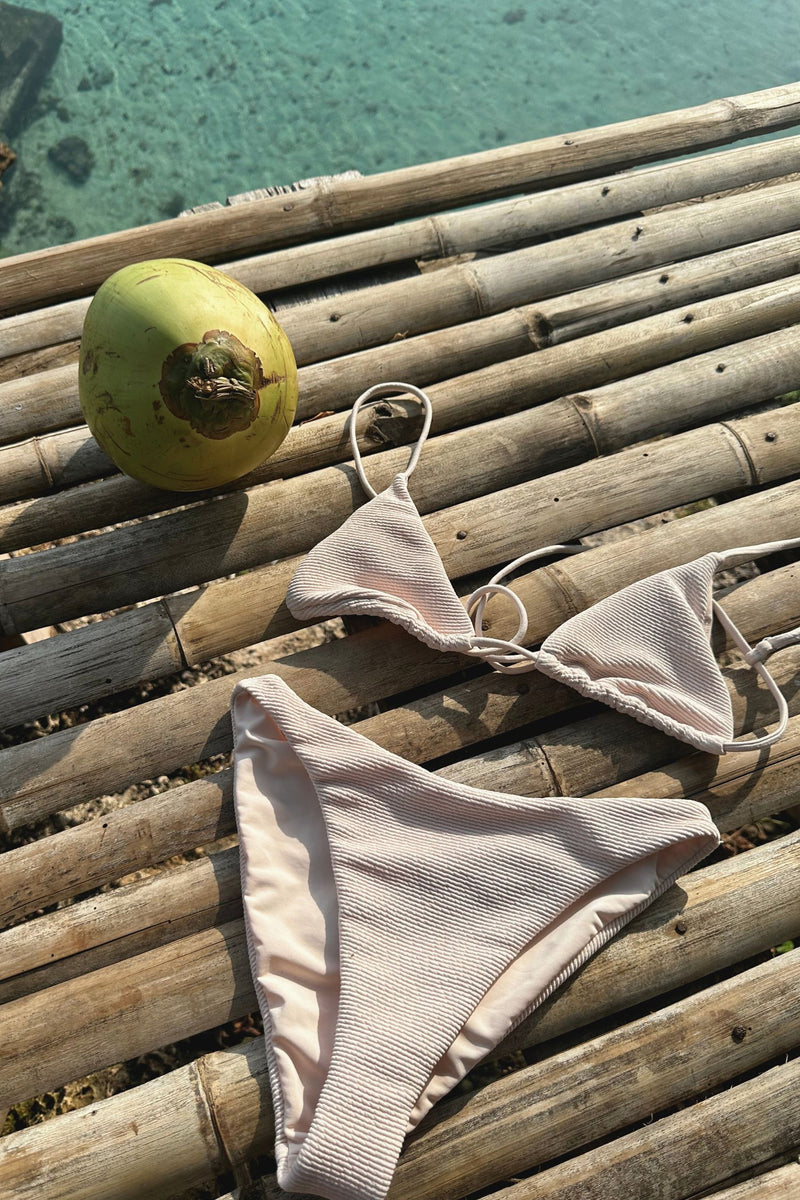 Flat lay of ribbed bikii set by lilya on island