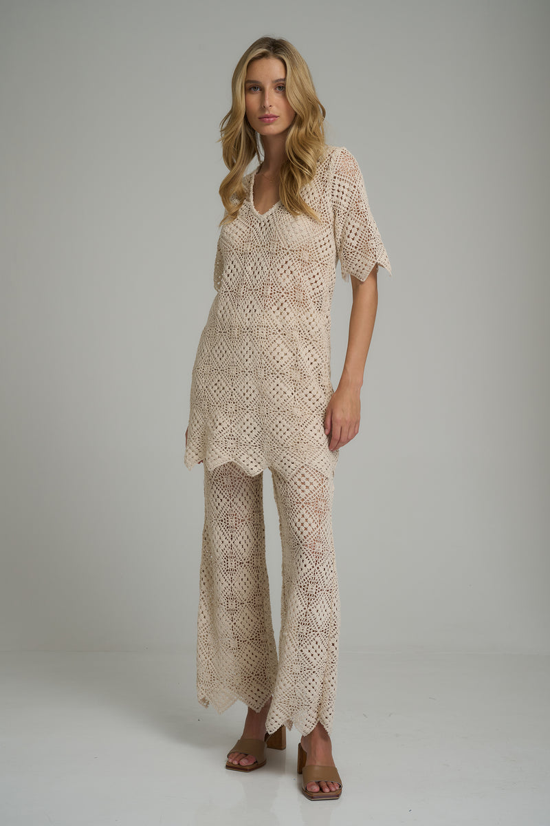 A model wearing 70's inspired cotton stretch lace pants