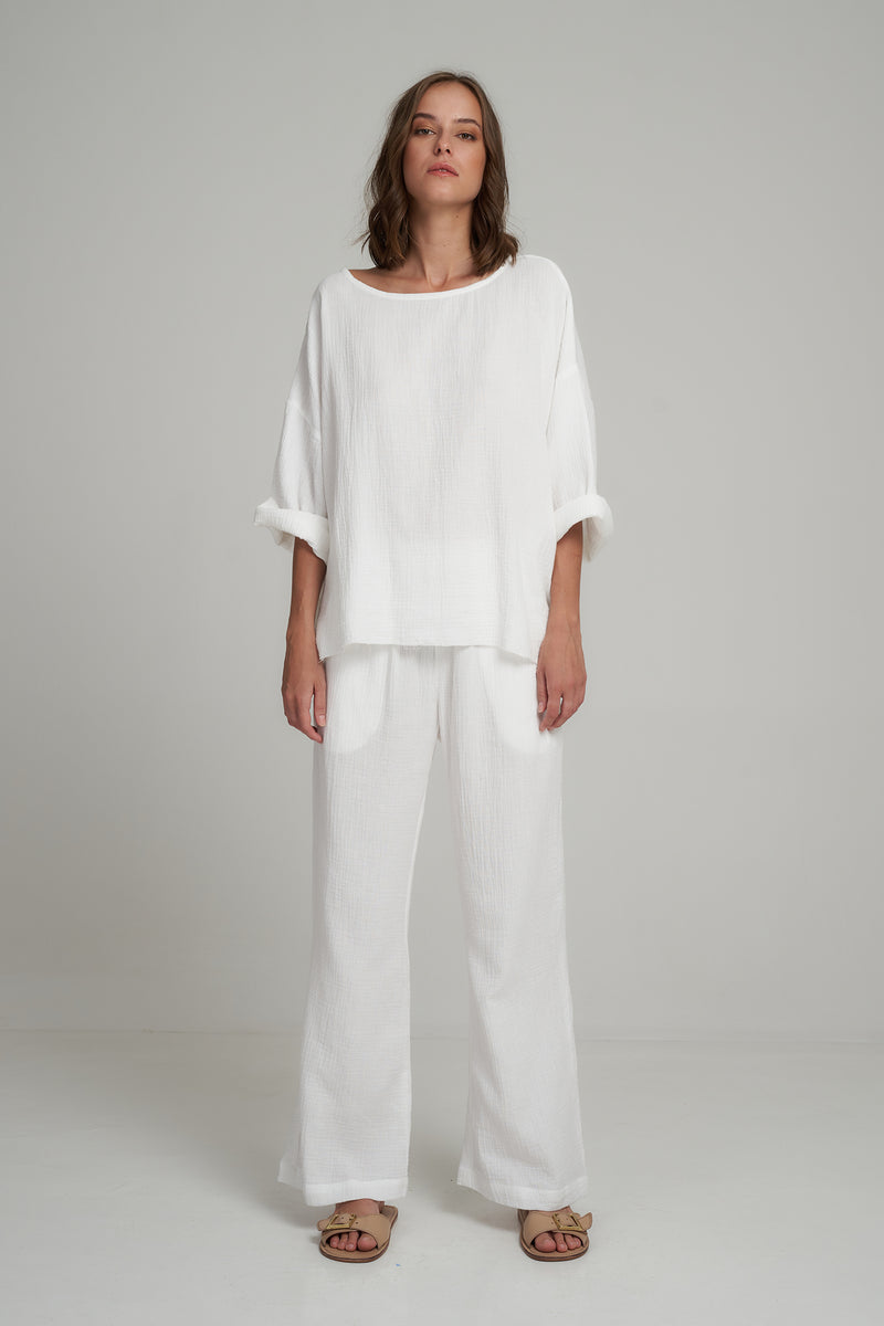 A Model Wearing a White Cotton Oversized Casual Top