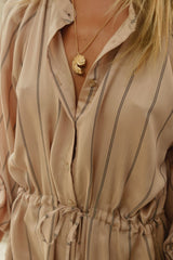 detail photo of stripe midi dress by LILYA with drawstring waist 