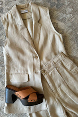 Flat lay of Malachite Vest by Lilya in linen sand colourway